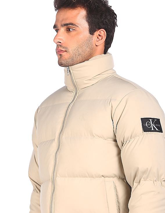 Buy Calvin Klein Men Beige High Neck Solid Quilted Jacket